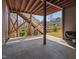 Covered patio offering a view of the yard with exterior stairs and an outdoor grill at 437 Creekhurst Pl, Cary, NC 27519