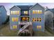 Rear view showing a large back deck and the home's solar panels at 437 Creekhurst Pl, Cary, NC 27519
