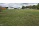 Expansive backyard features two sheds and plenty of room for activities at 46 Grain Ln, Henderson, NC 27537