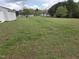 The large, level backyard is perfect for outdoor gatherings at 46 Grain Ln, Henderson, NC 27537