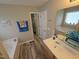 Bathroom showcasing a tub, single vanity and neutral paint at 46 Grain Ln, Henderson, NC 27537