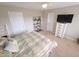 Comfortable bedroom with neutral walls, ceiling fan, and plenty of natural light, offering a relaxing retreat at 46 Grain Ln, Henderson, NC 27537