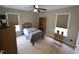 Spacious bedroom with ample natural light, featuring carpeted floors and neutral walls at 46 Grain Ln, Henderson, NC 27537