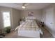 Bright bedroom with a ceiling fan and white furniture, offering a cozy and inviting space at 46 Grain Ln, Henderson, NC 27537