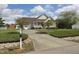 This home has a well-manicured front yard and long driveway, perfect for multiple vehicles at 46 Grain Ln, Henderson, NC 27537