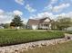 Beautiful home with a well-manicured front yard and charming curb appeal in a suburban neighborhood at 46 Grain Ln, Henderson, NC 27537