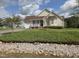 Charming one-story home with a well-manicured lawn and inviting front porch, perfect for relaxation at 46 Grain Ln, Henderson, NC 27537