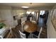 Spacious kitchen with stainless steel appliances, breakfast nook, and wood flooring, ideal for Gathering gatherings at 46 Grain Ln, Henderson, NC 27537