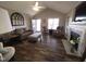 Comfortable living room with wood flooring, fireplace, and plenty of natural light, perfect for entertaining at 46 Grain Ln, Henderson, NC 27537