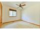 This bedroom features neutral carpet and walls and a ceiling fan at 505 Marion Way, Chapel Hill, NC 27516