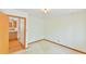 Bright, clean bedroom with neutral carpet and view into the kitchen at 505 Marion Way, Chapel Hill, NC 27516