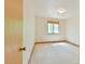 A bedroom features neutral walls, carpet and wood trim, plus a window with shade at 505 Marion Way, Chapel Hill, NC 27516
