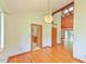 Bright dining room with hardwood floors, light fixture, and entry view into kitchen at 505 Marion Way, Chapel Hill, NC 27516