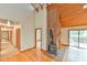 Spacious living room with hardwood floors, wood burning stove, and natural light at 505 Marion Way, Chapel Hill, NC 27516