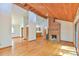 Open-concept living space with wood ceilings, fireplace, and hardwood floors at 505 Marion Way, Chapel Hill, NC 27516