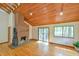 The living room is bright with a fireplace and beautiful wood ceiling at 505 Marion Way, Chapel Hill, NC 27516