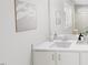 Well-lit bathroom with a spacious countertop, white cabinets, and modern fixtures at 520 Folk Song Way, Wendell, NC 27591