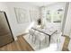 Elegant dining room with stylish chandelier, modern art, and a view to the outside at 520 Folk Song Way, Wendell, NC 27591