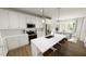 Bright kitchen featuring white cabinets, stainless appliances, and a large island with seating at 520 Folk Song Way, Wendell, NC 27591