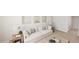 Living room features a comfortable sofa, stylish decor, and views into another room at 520 Folk Song Way, Wendell, NC 27591