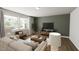 Comfortable living room with large windows, plush seating, and modern decor at 520 Folk Song Way, Wendell, NC 27591