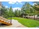 Lush green backyard featuring a well-maintained lawn and steps leading up to backyard at 528 Clifton Blue St, Wake Forest, NC 27587