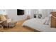 Relaxing bedroom with a comfortable seating area, hardwood floors, and access to an outdoor space at 528 Clifton Blue St, Wake Forest, NC 27587
