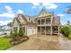 Stunning two-story home featuring a welcoming front porch and manicured landscaping, creating inviting curb appeal at 528 Clifton Blue St, Wake Forest, NC 27587