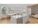 Eat-in kitchen with white counters, stainless appliances, natural light, and casual dining area at 528 Clifton Blue St, Wake Forest, NC 27587