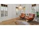 Cozy living room with hardwood floors, comfortable seating, natural light, and a decorative rug at 528 Clifton Blue St, Wake Forest, NC 27587