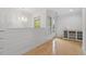 Bright loft area with hardwood floors, elegant chandelier and built in shelves at 528 Clifton Blue St, Wake Forest, NC 27587