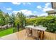 Wooden deck with chairs and table featuring a picturesque view of green backyard at 528 Clifton Blue St, Wake Forest, NC 27587