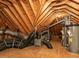 Image of attic with exposed beams, HVAC ducts and mechanical equipment at 5768 Cavanaugh Dr, Raleigh, NC 27614