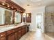 Spacious bathroom features a large vanity, glass shower, and a separate toilet area at 5768 Cavanaugh Dr, Raleigh, NC 27614