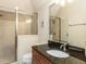 Bathroom featuring granite countertops, glass shower enclosure and tile flooring at 5768 Cavanaugh Dr, Raleigh, NC 27614