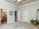 Carpeted bedroom features multiple windows, doors to the bathroom and hallway, and decorative mirror at 5768 Cavanaugh Dr, Raleigh, NC 27614