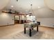 Entertainment bonus room featuring foosball table, projector and custom lighting at 5768 Cavanaugh Dr, Raleigh, NC 27614