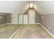 Carpeted bonus room with mirror and storage closet, perfect for a flexible space at 5768 Cavanaugh Dr, Raleigh, NC 27614