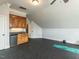 Large bonus room features a wet bar, mini fridge and plenty of space for fitness or relaxation at 5768 Cavanaugh Dr, Raleigh, NC 27614