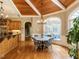 Cozy breakfast nook with a round table, chandelier, wood ceilings, and large windows at 5768 Cavanaugh Dr, Raleigh, NC 27614