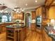 Gourmet kitchen with stainless steel appliances, granite countertops, and a large center island at 5768 Cavanaugh Dr, Raleigh, NC 27614