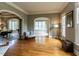 Bright living room with hardwood floors and arched openings at 5768 Cavanaugh Dr, Raleigh, NC 27614