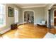 Sunny living room featuring hardwood floors and wainscoting at 5768 Cavanaugh Dr, Raleigh, NC 27614