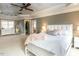 Spacious main bedroom with trey ceiling, a large window and seating area for relaxing at 5768 Cavanaugh Dr, Raleigh, NC 27614