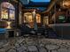 Exterior stone patio featuring a built-in grill, an outdoor kitchen and a screened porch at 5768 Cavanaugh Dr, Raleigh, NC 27614