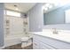 Well-lit bathroom with a tub/shower combo and a sleek vanity with a modern sink and faucet at 6 Hawaii Ct, Durham, NC 27713