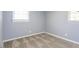 Cozy bedroom featuring a neutral carpet and two windows that provide plenty of natural light at 6 Hawaii Ct, Durham, NC 27713