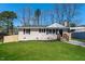 Charming brick home with a well-manicured lawn and inviting front entrance at 6 Hawaii Ct, Durham, NC 27713