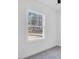 Bedroom with a window that has a view of the surrounding wooded landscape at 604 E Pope St, Dunn, NC 28334