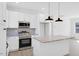 Contemporary kitchen features a center island and modern stainless appliances at 604 E Pope St, Dunn, NC 28334